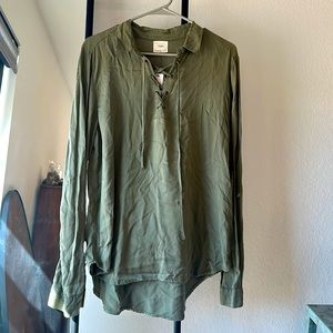 Dark green blouse with lace up front. Never worn. Perfect for fall weather!